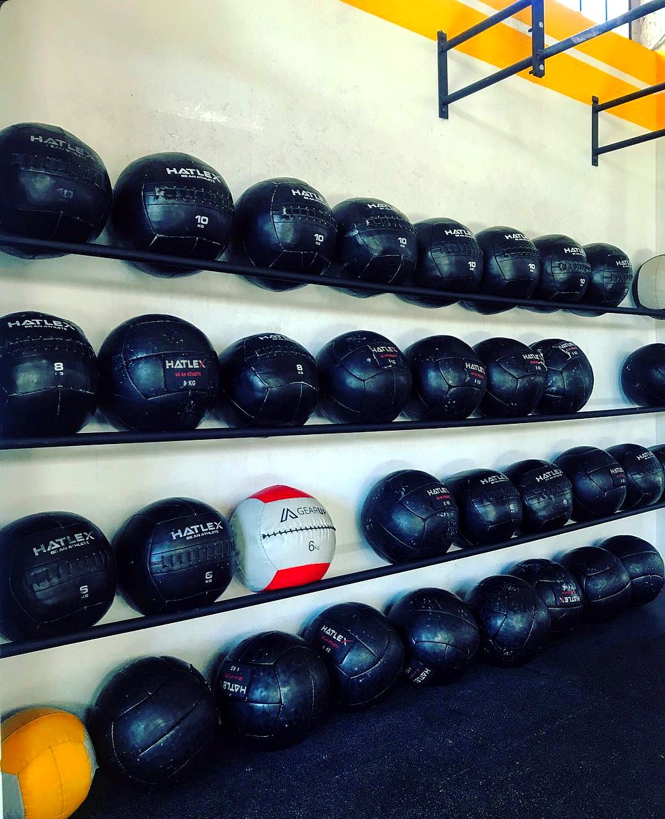 A full wall of wall-balls on the rack at Campus Kifissia